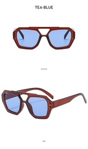 Detail view of tea-blue pilot sunglasses with double bridge and polygonal frame design