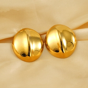 Polished 18K gold-plated stainless steel liquid heart stud earrings on silk background