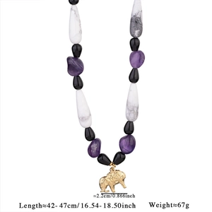 Detailed view showing gemstone necklace length specifications and golden elephant pendant