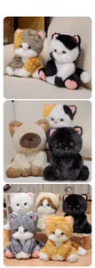 Detailed view of various plush cats showing soft textures and realistic beaded eyes
