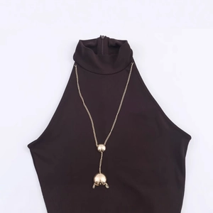 Women's halter neck sleeveless top with gold chain and spherical pendant detailing