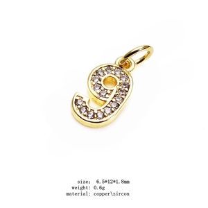Detailed view of 14K gold plated number 9 pendant with micro-paved cubic zirconia gems