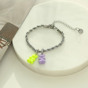 Stainless steel chain bracelet featuring fluorescent yellow and light purple bear charms