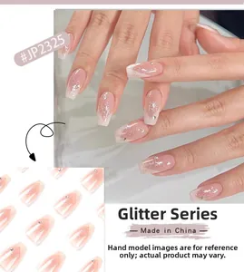 Detailed view of pink white gradient press-on nails with silver glitter and rhinestones