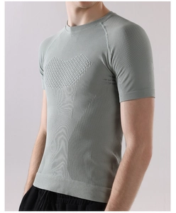 Macro shot of breathable honeycomb fabric and seamless knit on men's gray-green gym t-shirt