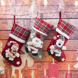 Detail of Christmas stocking gift bags with 3D Santa, Snowman and Polar Bear dolls
