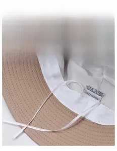 Detail of khaki bucket hat featuring white lining and adjustable inner drawstring