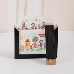 Black wooden children's art frame with magnetic front opening for storage and display