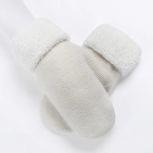 Thick warm knitted mittens for women in white with cozy plush fleece cuffs
