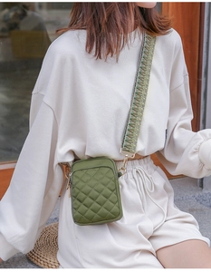 Army green quilted crossbody bag with jacquard wide shoulder strap and gold hardware