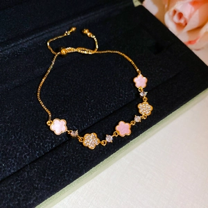 Detail of pink floral bracelet with zircon accents on black velvet jewelry box