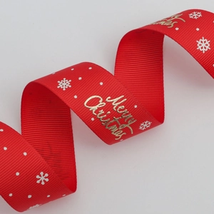 Ruban gros-grain rouge de Noël avec texte doré Merry Christmas et flocons blancs
