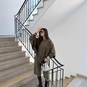 Women olive green suede jacket and bermuda shorts set with chic street style