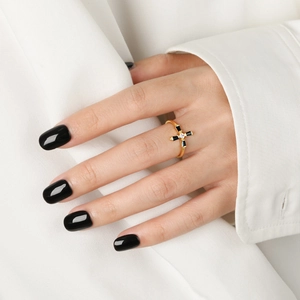 Gold cross ring for women featuring black rectangular stone and white diamond inlay