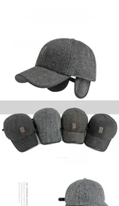 Detailed close-up of herringbone pattern wool baseball caps with fold-down ear flaps in four colors
