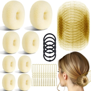 Hair styling tool kit with beige bun makers, elastic bands, gold pins, and invisible hair nets