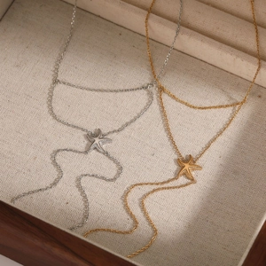Minimalist starfish hand chain in gold and silver finish for beach style jewelry