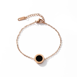 Rose gold stainless steel bracelet with black round pendant and Roman numeral engraving