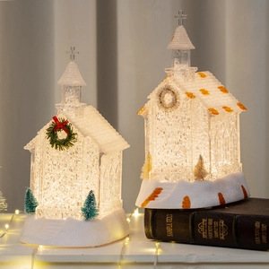 Luminous Christmas church houses with warm glowing lights and snowy base decorations