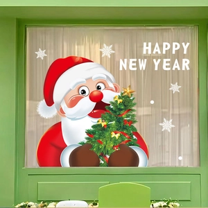 Detailed view of Santa and Christmas tree static window stickers on a green background