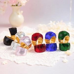 Collection of multi-colored faceted crystal rings with 18k gold plated metal bands