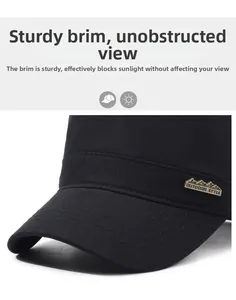 Detailed close-up of a sturdy outdoor military cap brim with bronze mountain logo