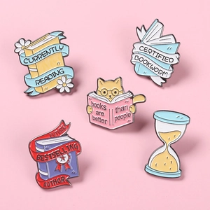 5-piece enamel book pin set featuring reading cats and floral designs on pink background