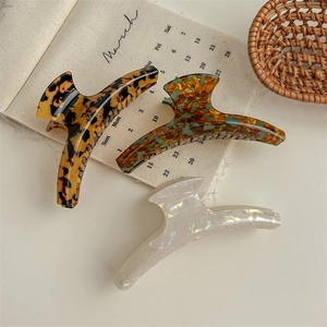 French retro leopard print hair claws in brown tortoiseshell and iridescent white finish