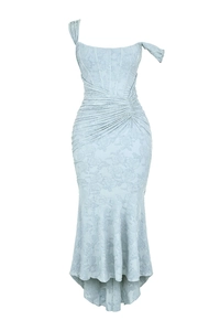Macro detail of light blue floral jacquard fabric on a strapless bodycon long dress