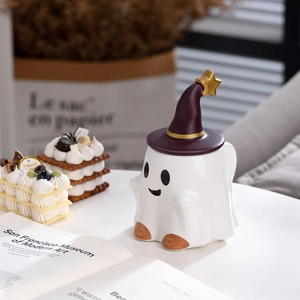 Detail of white ceramic ghost mug featuring a dark purple wizard hat lid with gold stars