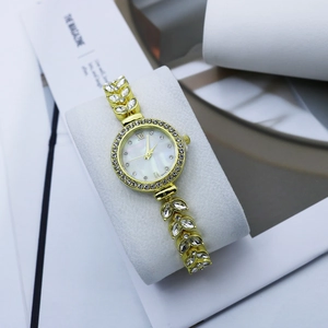 Luxury gold women's watch with crystal leaf bracelet and mother of pearl dial