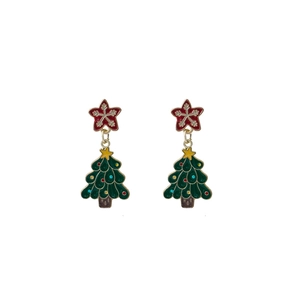 Detail of Christmas tree earrings with red star charm and green enamel finish