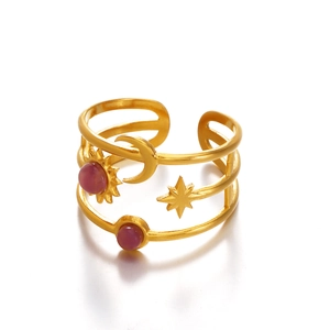 Gold celestial ring with moon sun stars and purple stones in layered open design