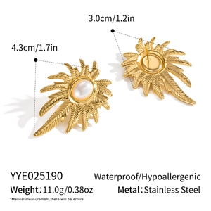 Macro detail of gold palm tree pearl earrings showing size and stainless steel material