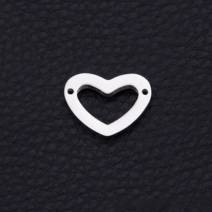 Polished silver stainless steel hollow heart connector with dual holes on black leather