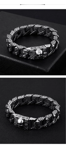 Detail of silver skull punk bracelet showing scale texture and detailed metal clasp