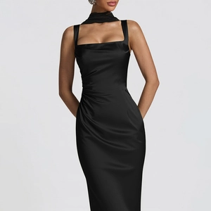 Detail view of black satin strap dress with side ruching and elegant waist tailoring