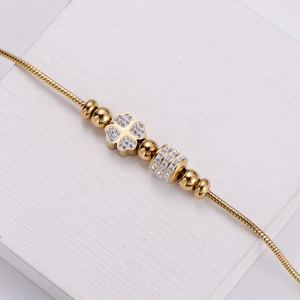 PVD plated 18k gold clover charm bracelet with sparkling crystals on snake chain