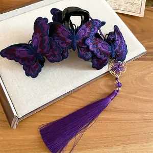 Pinza per capelli con farfalle ricamate tradizionali con nappe viola e ciondolo d'oro