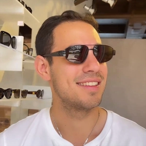 Retro double-bridge oval sunglasses with black metal frame and triomphe temple detail