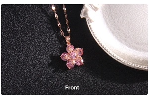 Front view of rose gold four-leaf clover pendant with pink zircon crystals and fine chain
