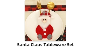 Detail of Santa Claus felt cutlery holder with gold fork and spoon on a white plate