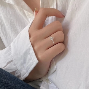 Elegant 925 sterling silver ring with pear-shaped cubic zirconia on a slender textured band