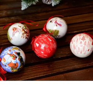 Five 7cm Christmas foam balls with Santa and reindeer prints on rustic wooden background