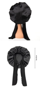 Detail view of black satin sleeping cap with long ties and a 26cm size reference