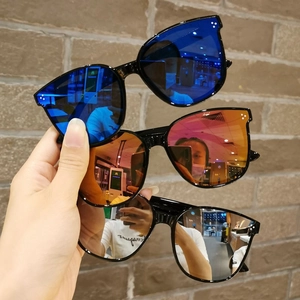 Three pairs of kids oversized sunglasses with blue, orange, and silver mirrored lenses