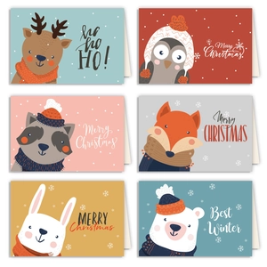 Flat lay of six Christmas cards with cute animal illustrations like reindeer and fox