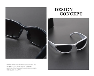 Close-up of retro sports sunglasses featuring carved decorative design and streamlined frame