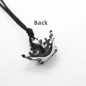 Macro view of the crown pendant back showing vintage hollow out patterns and details