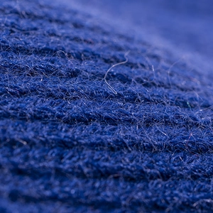 Women's warm navy blue knit beanie hat with thick double-fold cuff and ribbed texture